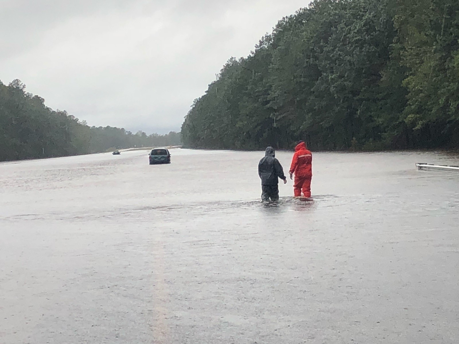 Coast Guard shallow-water response boat team members assist motorists stranded in floodwater caused by Hurricane Florence in North Carolina, September 16, 2018. (U.S. Coast Guard photograph) Coast Guard shallow-water response boat team members assist motorists stranded in floodwater caused by Hurricane Florence in North Carolina, September 16, 2018. (U.S. Coast Guard photograph)